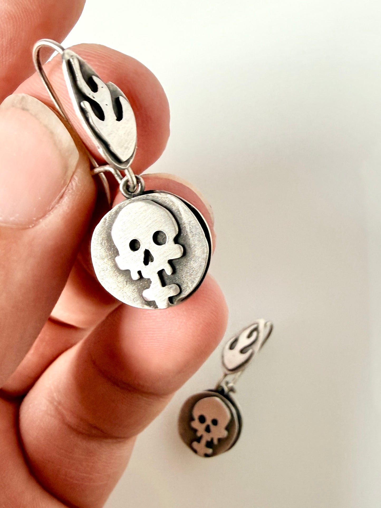 Sterling skull and flame drop earrings