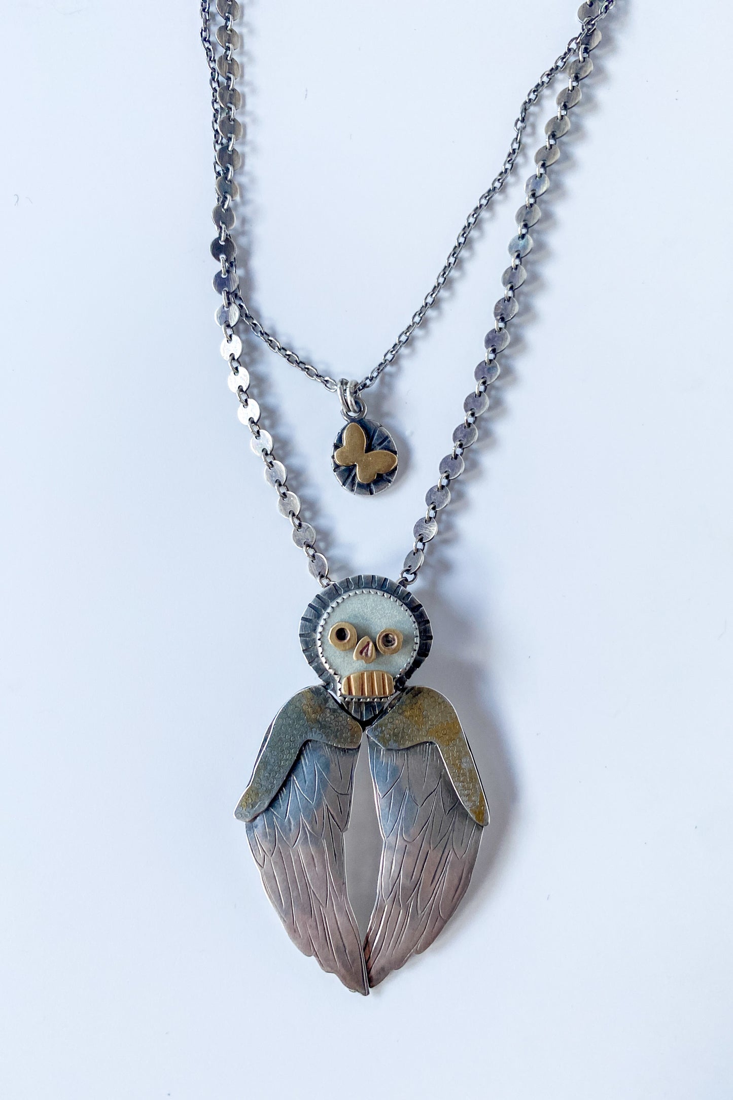 Winged skull necklace