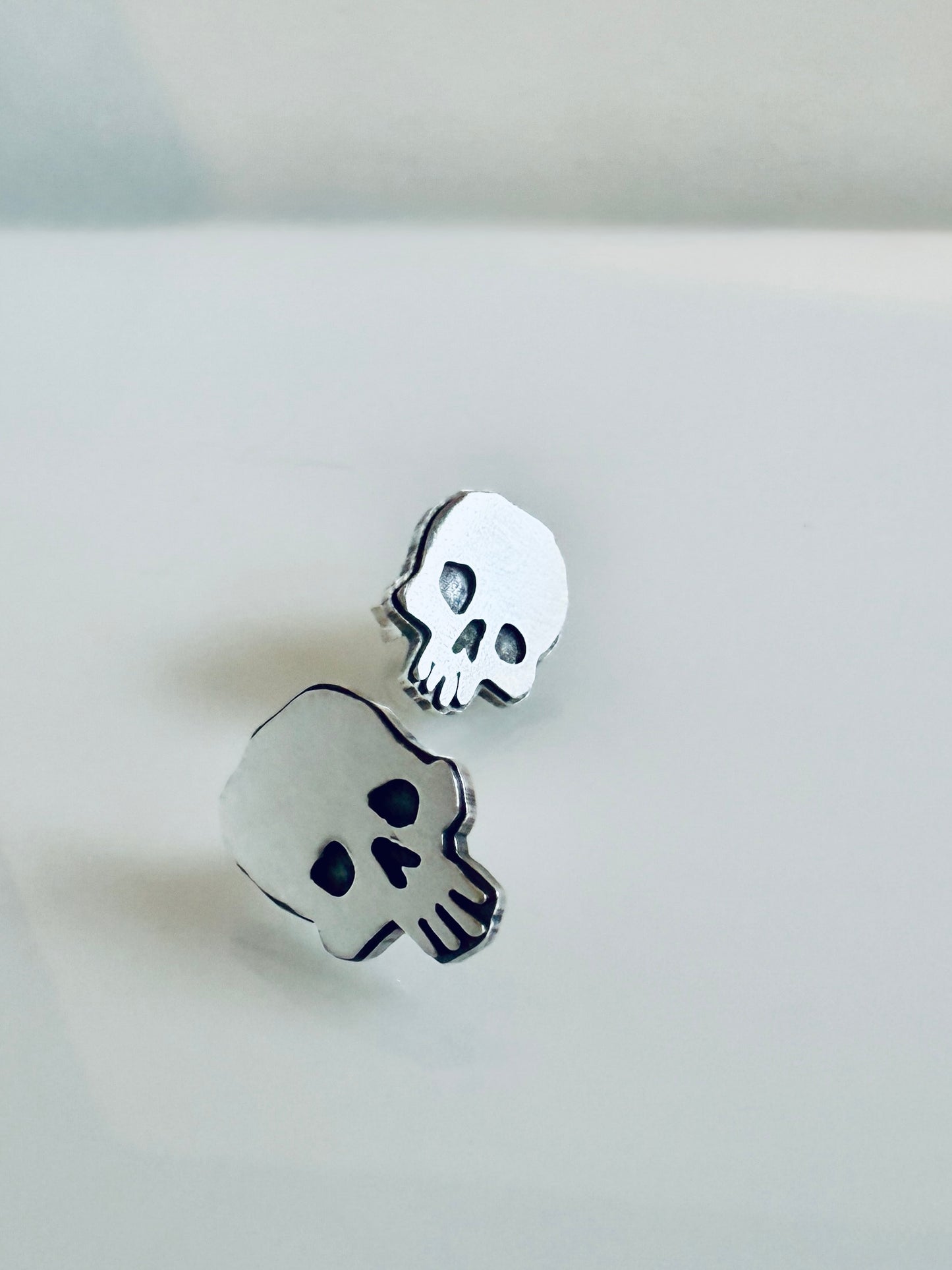 Spooky skull stud earrings