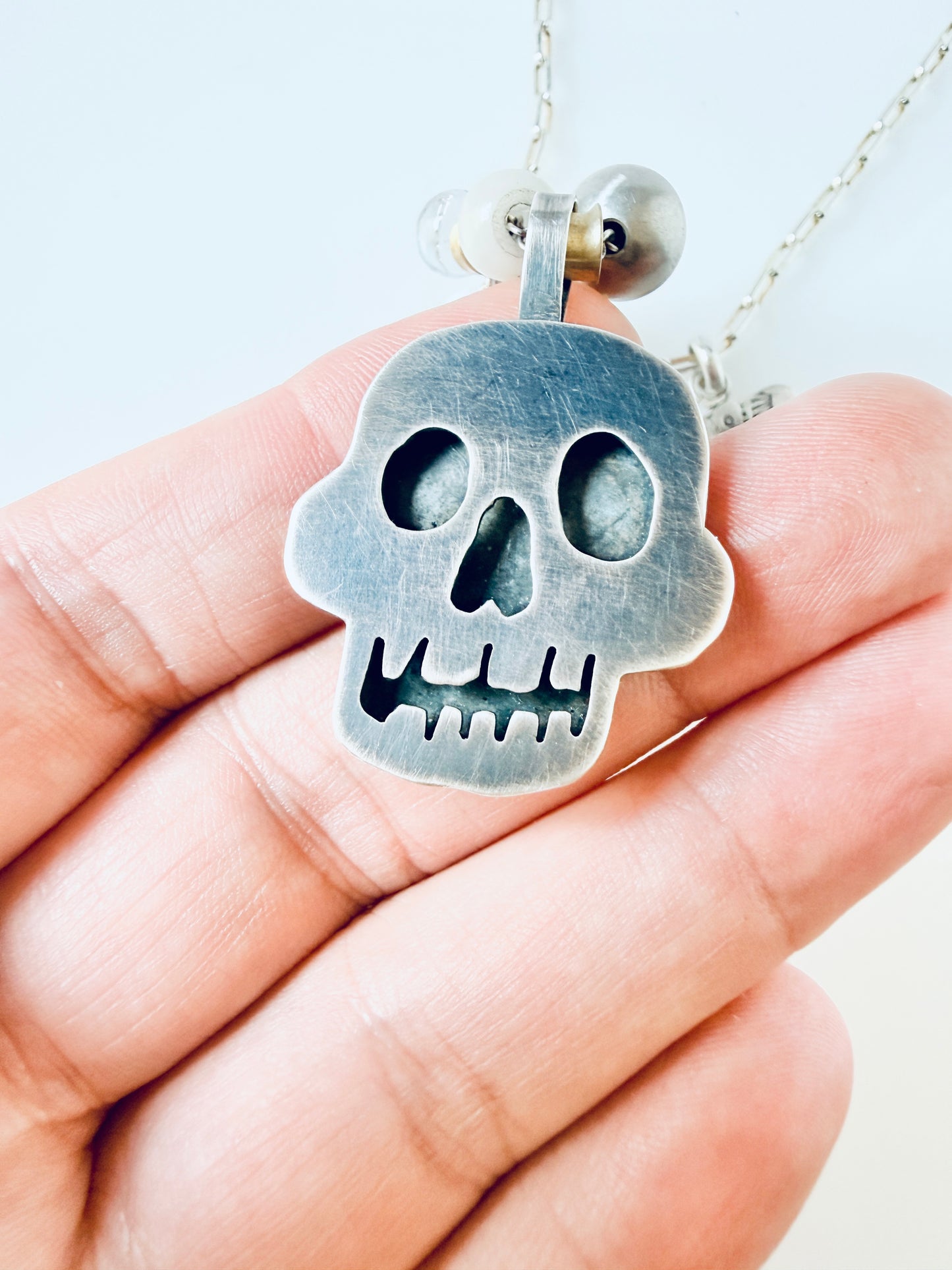 Sterling skull pendant with butterfly and beads
