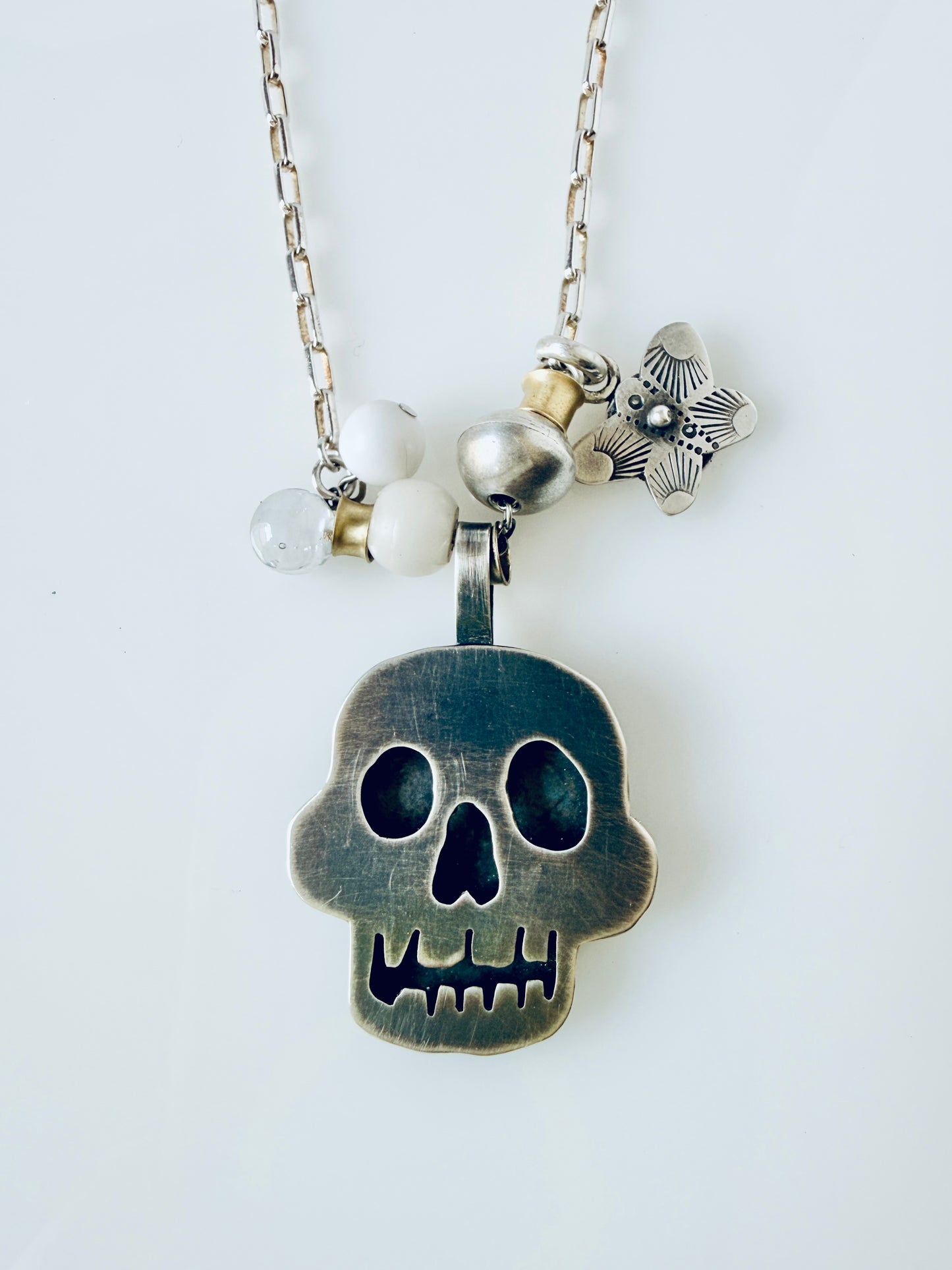 Sterling skull pendant with butterfly and beads