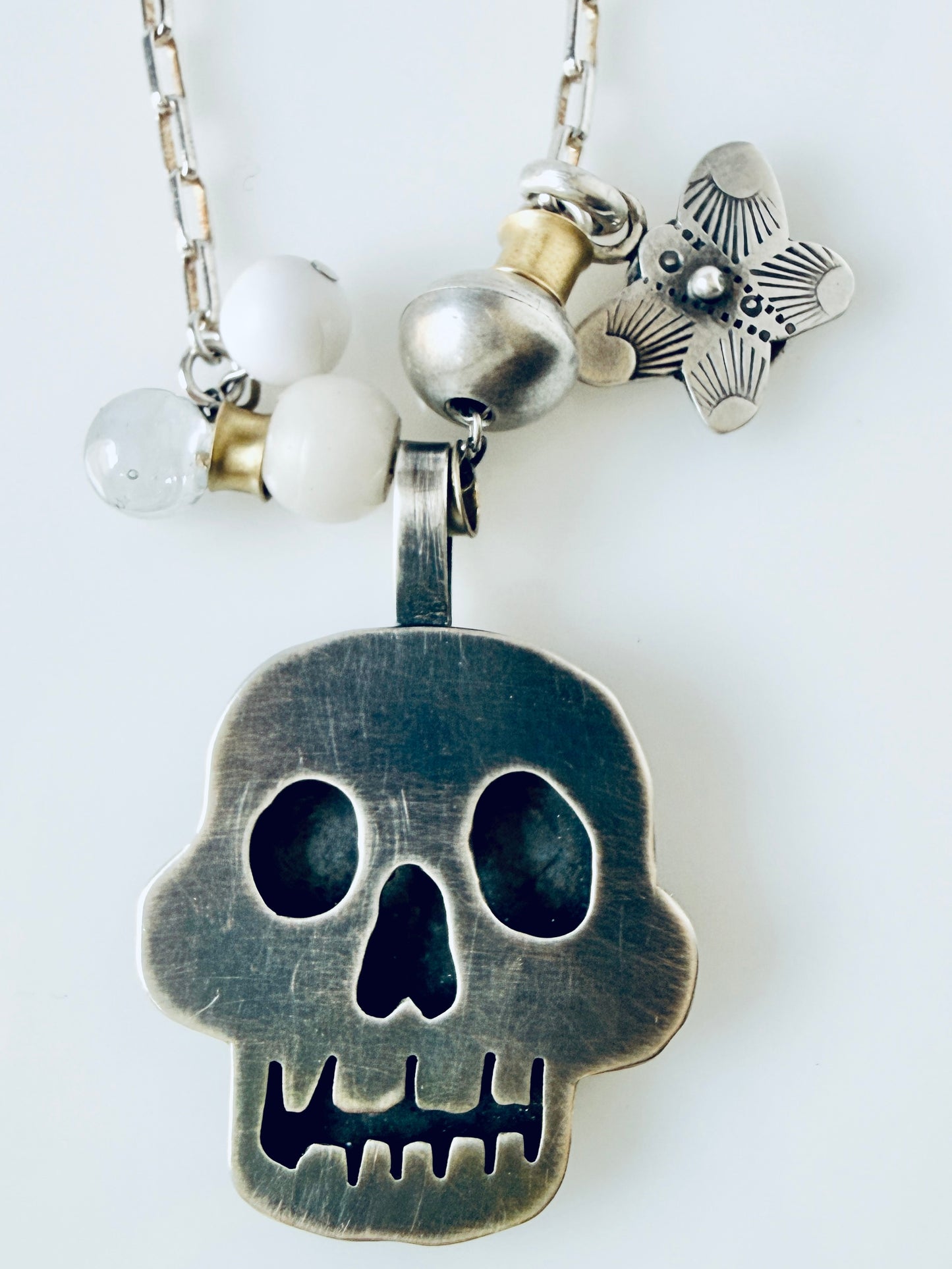 Sterling skull pendant with butterfly and beads