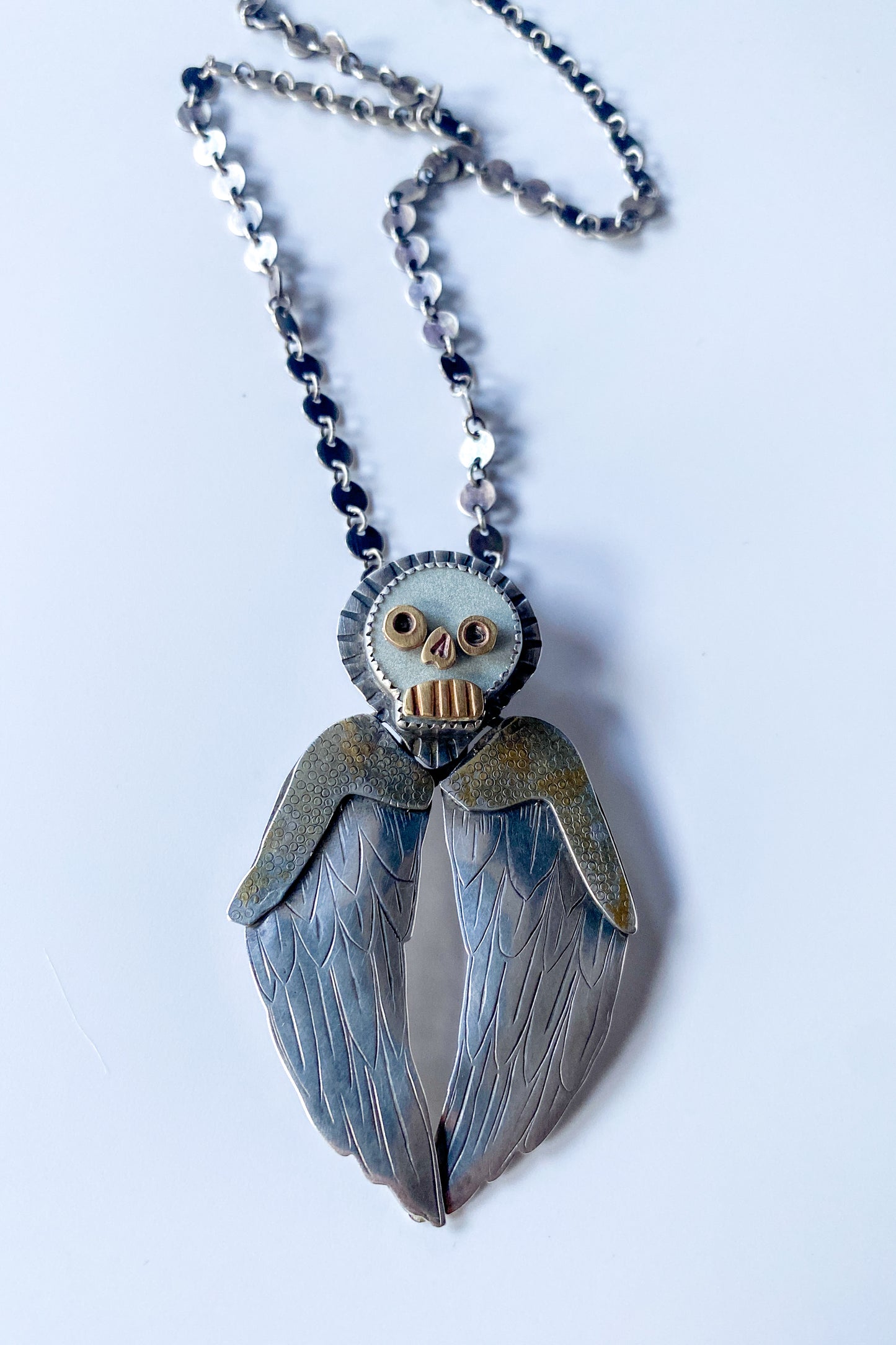 Winged skull necklace
