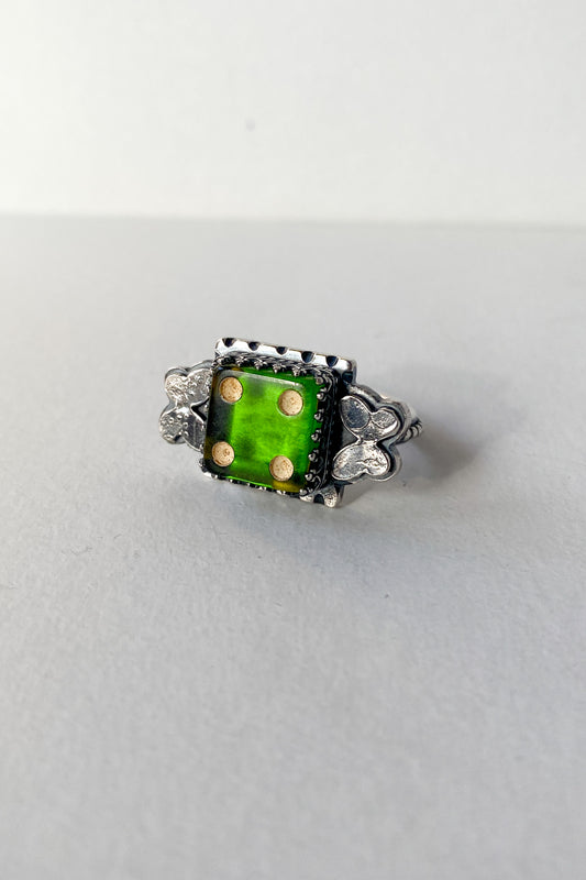 Green die and butterfly ring
