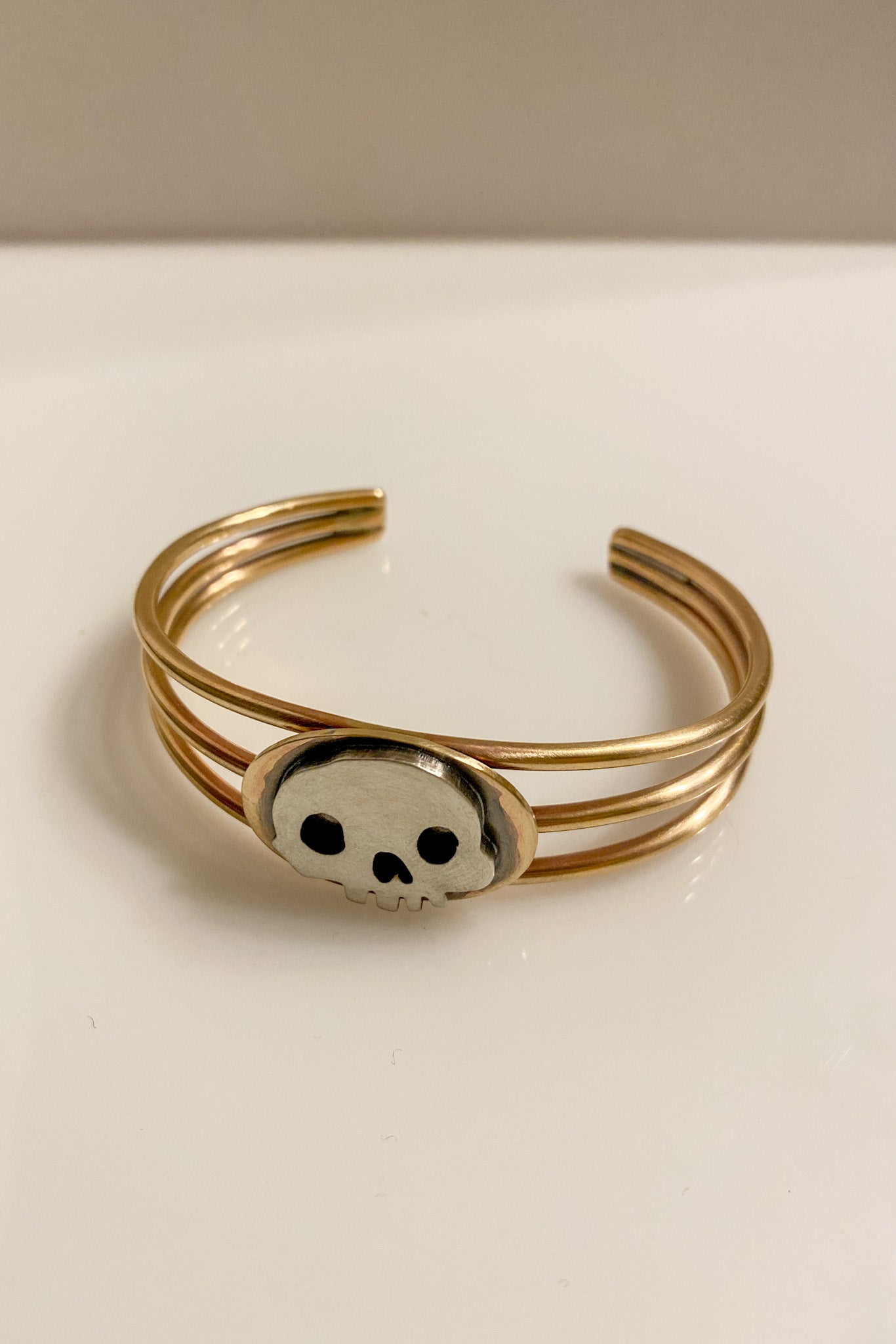 brass cuff with skull