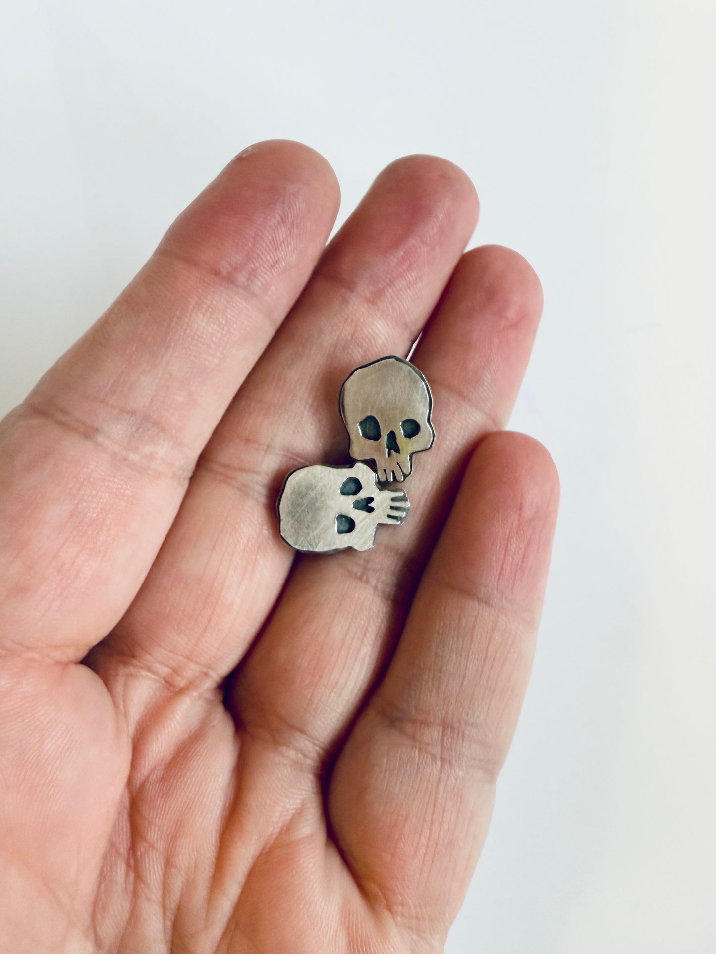 Spooky skull stud earrings